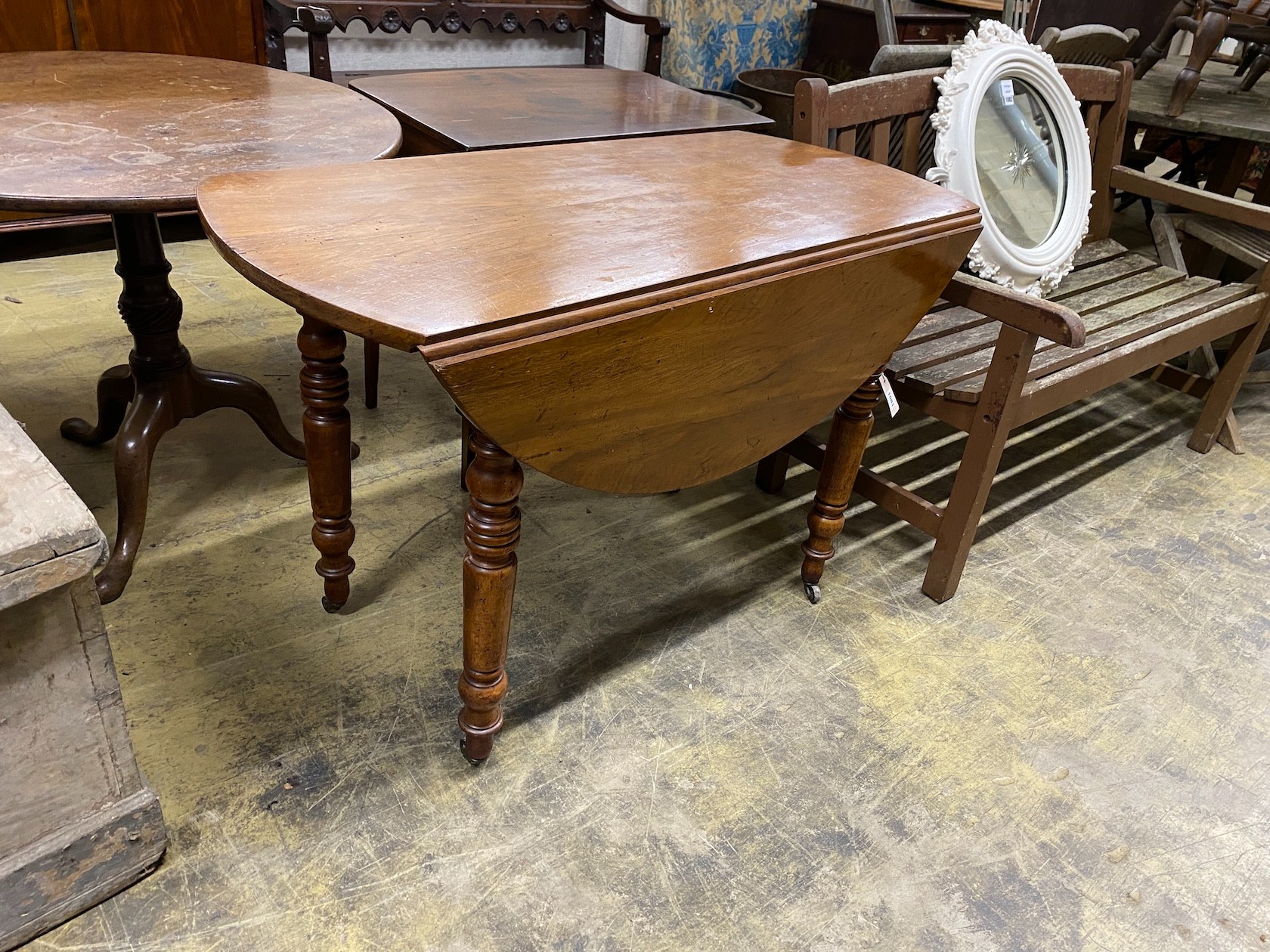 A 19th century French walnut drop flap table, width 110cm, depth 54cm, height 74cm